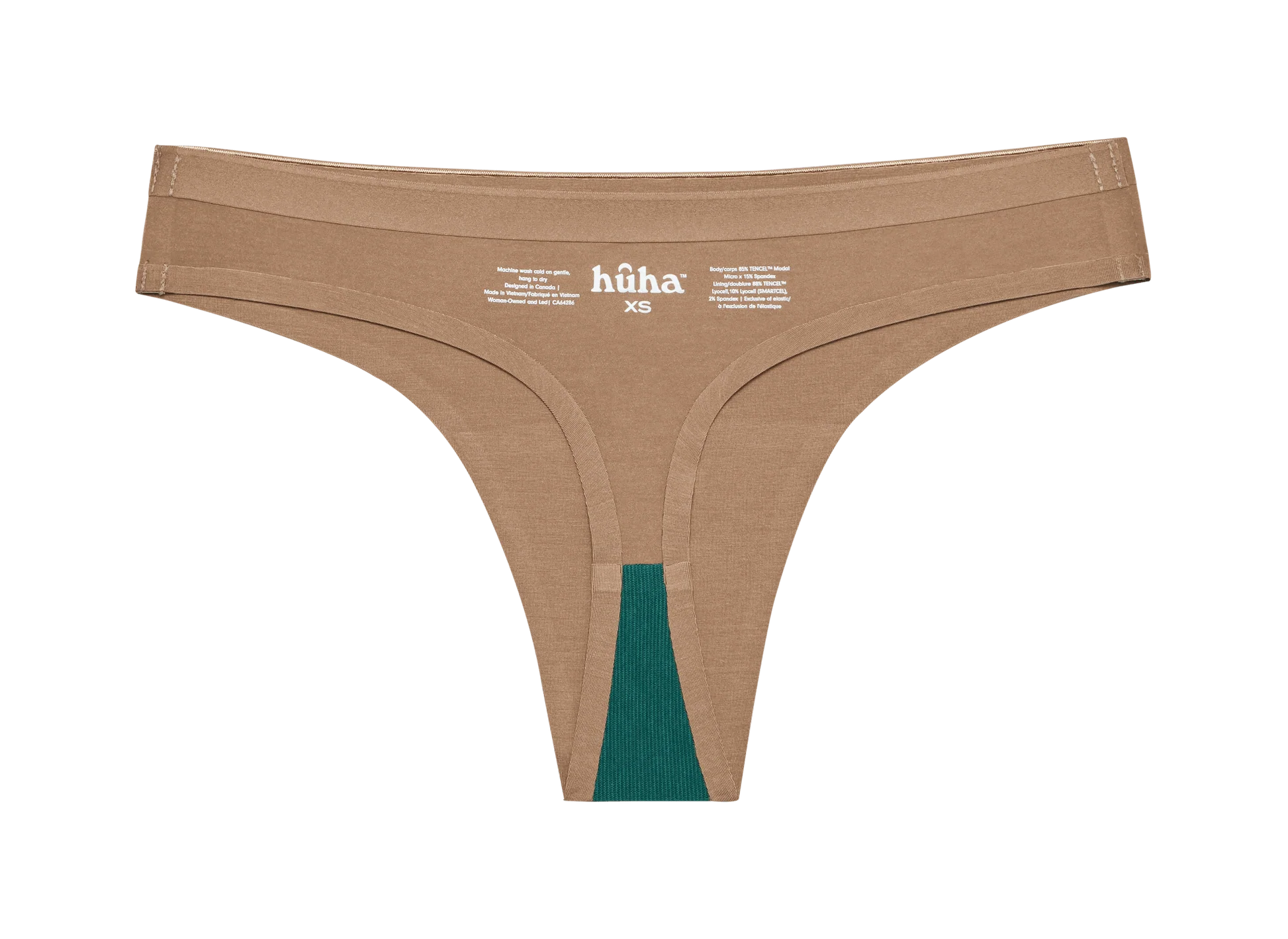 Huha Seamless Low Mid Thong in Tan, inside view laid flat showing the teal gusset and printed label