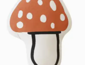 Imani Collective Mushroom Pillow, a rust red spotted toadstool canvas pillow, front view