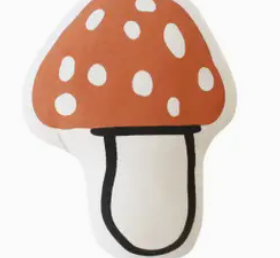 Imani Collective Mushroom Pillow, a rust red spotted toadstool canvas pillow, front view