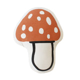 Imani Collective Mushroom Pillow, a rust red spotted toadstool-shaped canvas pillow