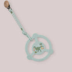 Jujube Roarsome Silicone Teether Ring, a sage green dinosaur-print teether with a pacifier clip