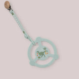 Jujube Roarsome Silicone Teether Ring, a sage green dinosaur-print teether with a pacifier clip