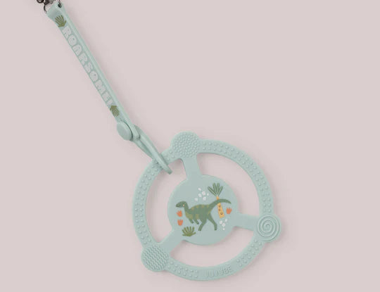 Jujube Roarsome Silicone Teether Ring, a sage green dinosaur-print teether with a pacifier clip
