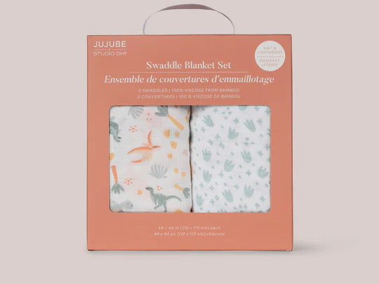Jujube Roarsome Swaddle Blanket Set in its terracotta gift box with a window