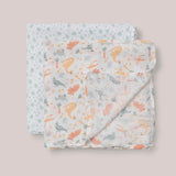 Jujube Roarsome Swaddle Blanket Set, two folded muslin swaddles with a colorful dinosaur print