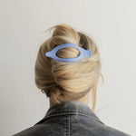 Kaxi Lay Down Claw 2.0 in Dusty Blue holding a French twist, back view