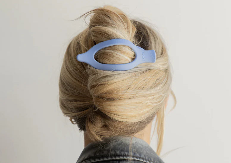 Kaxi Lay Down Claw 2.0 in Dusty Blue holding a French twist, back view