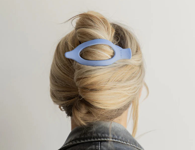 Kaxi Lay Down Claw 2.0 in Dusty Blue holding a French twist, back view