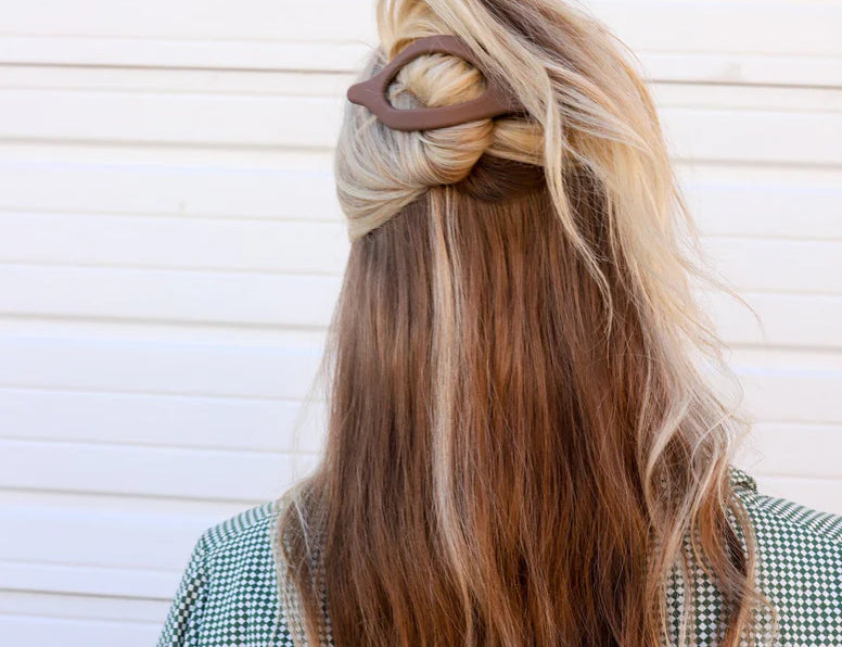 Kaxi Lay Down Claw 2.0 in taupe holding a half-up style in long blonde hair, back view