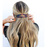 Kaxi Lay Down Claw hair clip in dark tortoise holding a half-up style in long blonde hair