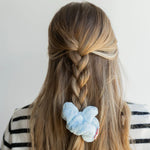 Kaxi Midi Towel Scrunchie in Baby Blue tied at the end of a French braid, back view