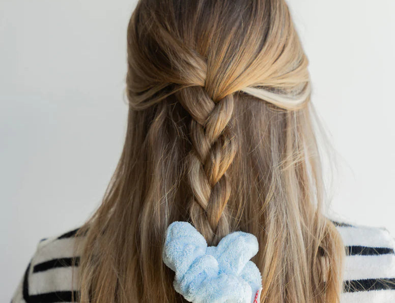 Kaxi Midi Towel Scrunchie in Baby Blue tied at the end of a French braid, back view