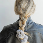 Kaxi Midi Towel Scrunchie in Light Grey tied at the end of a long braid, back view