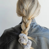 Kaxi Midi Towel Scrunchie in Light Grey tied at the end of a long braid, back view