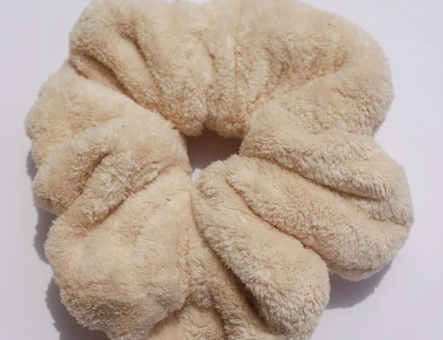Kaxi Oversized Towel Scrunchie in tan, a plush fluffy scrunchie on white