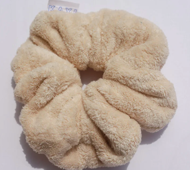 Kaxi Oversized Towel Scrunchie in tan, a plush fluffy scrunchie on white