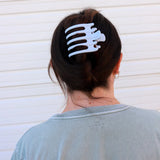 Kaxi Wide Lay Down Claw in Baby Blue holding a dark hair updo, back view