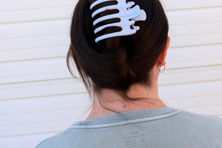 Kaxi Wide Lay Down Claw in Baby Blue holding a dark hair updo, back view