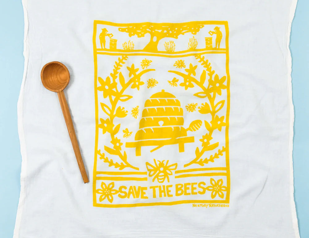 Kei & Molly Flour Sack Dish Towel in Bees, a white towel with a yellow beehive print reading Save the Bees