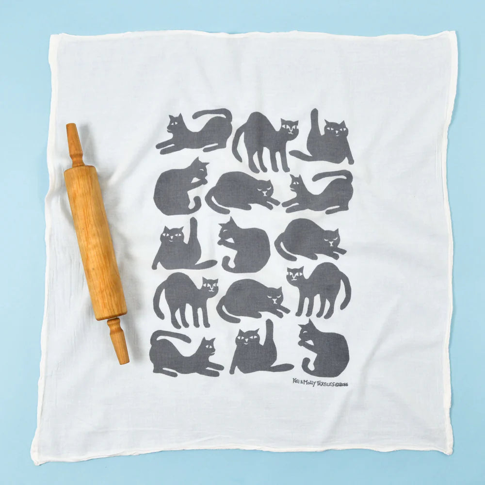 Kei & Molly Flour Sack Dish Towel in Grey Cats, a white towel with a grid of gray cat silhouettes