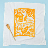 Kei & Molly Flour Sack Dish Towel in Grow Local Squash, a white towel with an orange garden and chicken print