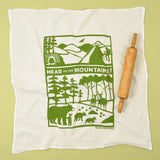 Kei & Molly Flour Sack Dish Towel in Head to the Mountains, a white towel with a green mountain and bear print
