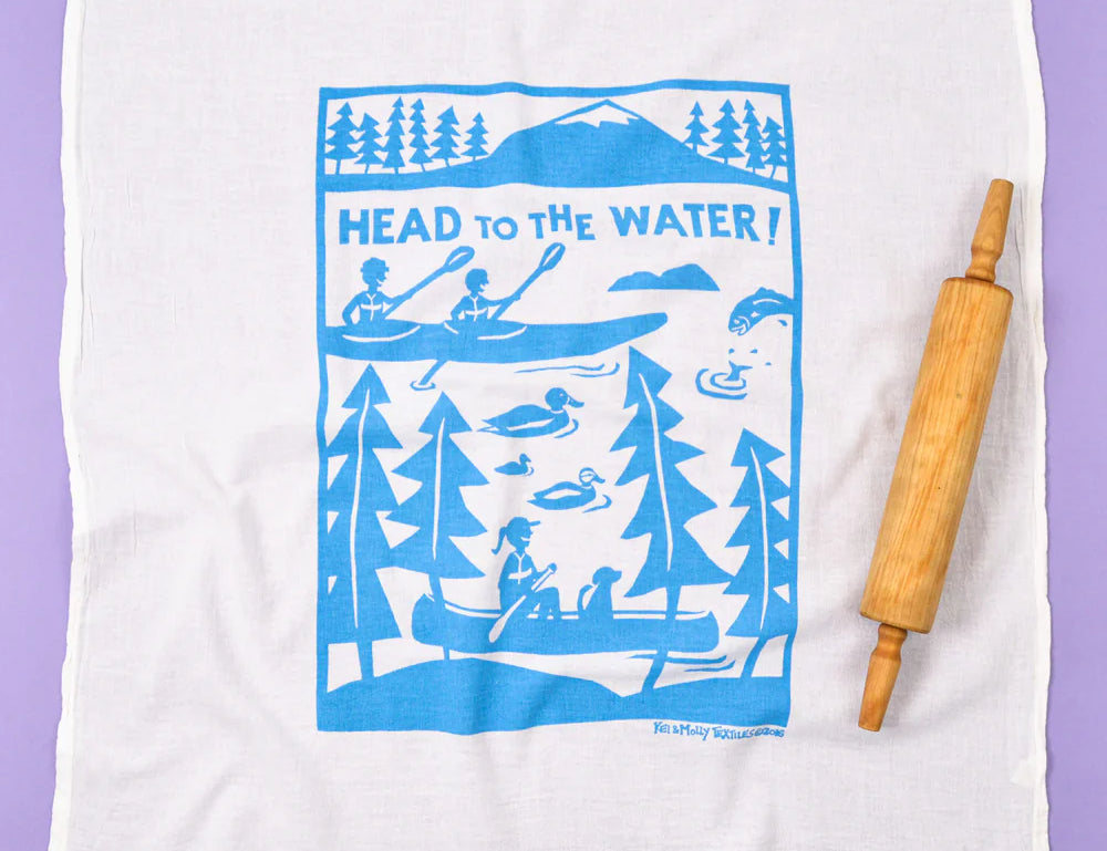 Kei & Molly Flour Sack Dish Towel in Head to the Water, a white towel with a blue canoe and lake print