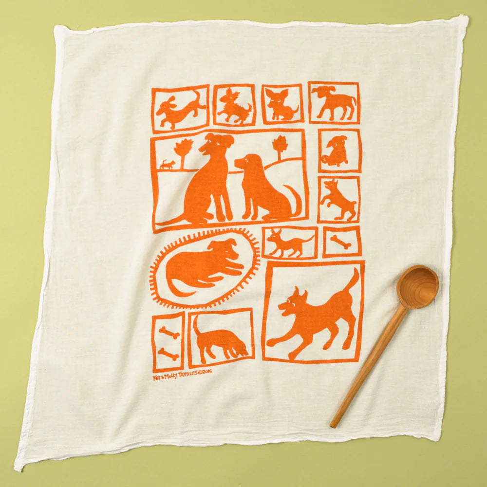 Kei & Molly Flour Sack Dish Towel in Orange Dogs, a white towel with a grid of orange dog illustrations
