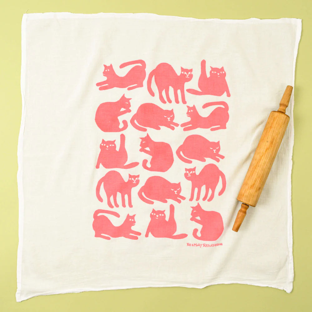 Kei & Molly Flour Sack Dish Towel in Pink Cats, a white towel with a grid of pink cat silhouettes