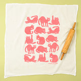 Kei & Molly Flour Sack Dish Towel in Pink Cats, a white towel with a grid of pink cat silhouettes