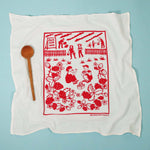 Kei & Molly Flour Sack Dish Towel in Strawberries, a white towel with a red strawberry-picking print