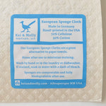 Back of a Kei & Molly Sponge Cloth showing the blue care and info label