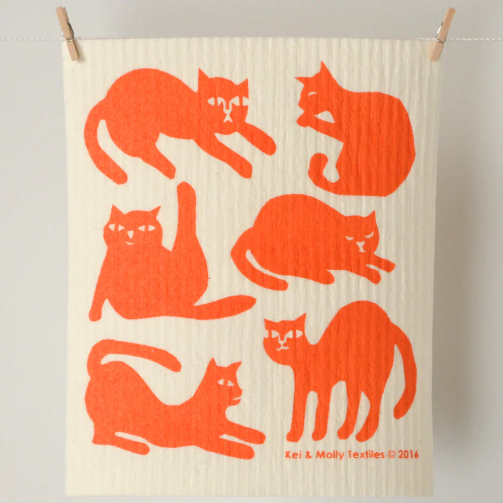 Kei & Molly Sponge Cloth in Cats, a cream cloth with an orange cat silhouette print