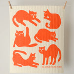 Kei & Molly Sponge Cloth in Cats, a cream cloth with an orange cat silhouette print