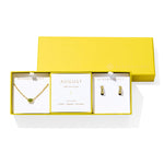 Kendra Scott Cailin Birthstone Gift Set for August in gold with Light Green Crystal, a pendant necklace and huggie earrings in a yellow gift box