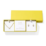 Kendra Scott Cailin Birthstone Gift Set for June in gold with Ivory Mother of Pearl, a pendant necklace and huggie earrings in a yellow gift box