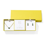 Kendra Scott Cailin Birthstone Gift Set for May in gold with Green Crystal, a pendant necklace and huggie earrings in a yellow gift box