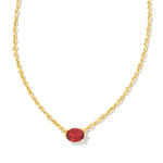 Kendra Scott Cailin Gold Birthday Pendant Necklace in Burgundy Crystal, a gold chain with a small red oval stone