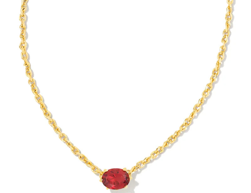 Kendra Scott Cailin Gold Birthday Pendant Necklace in Burgundy Crystal, a gold chain with a small red oval stone