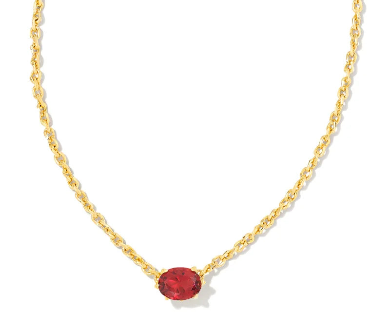 Kendra Scott Cailin Gold Birthday Pendant Necklace in Burgundy Crystal, a gold chain with a small red oval stone