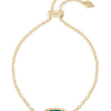 Kendra Scott Elaina Delicate Chain Bracelet in gold with a small teal stone, full-length view with slider clasp
