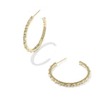 Kendra Scott Fate Hoop Earrings in gold, a pair of open hoops lined with small spikes and cubic zirconia