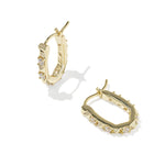 Kendra Scott Fate Huggie Earrings in gold, a pair of hinged oval huggies with spike and cubic zirconia detail