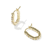 Kendra Scott Fate Huggie Earrings in gold, a pair of hinged oval huggies with spike and cubic zirconia detail