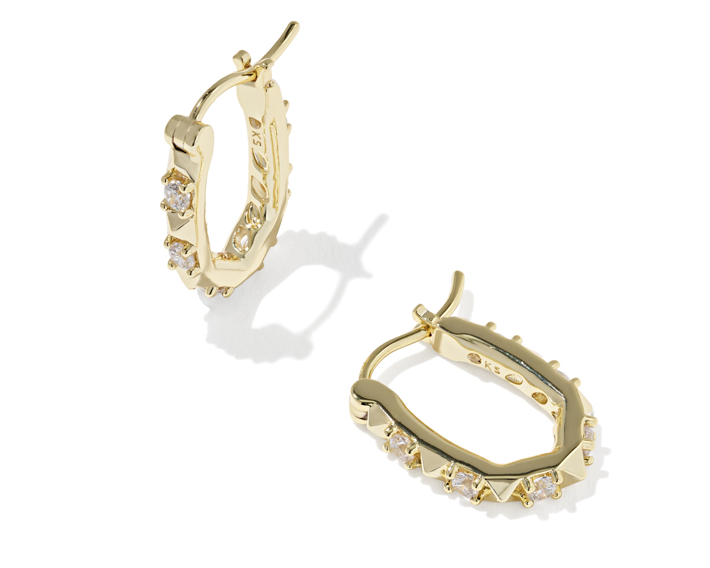 Kendra Scott Fate Huggie Earrings in gold, a pair of hinged oval huggies with spike and cubic zirconia detail