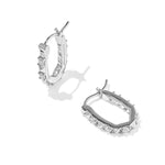 Kendra Scott Fate Huggie Earrings in rhodium silver, a pair of hinged oval huggies with spike and cubic zirconia detail