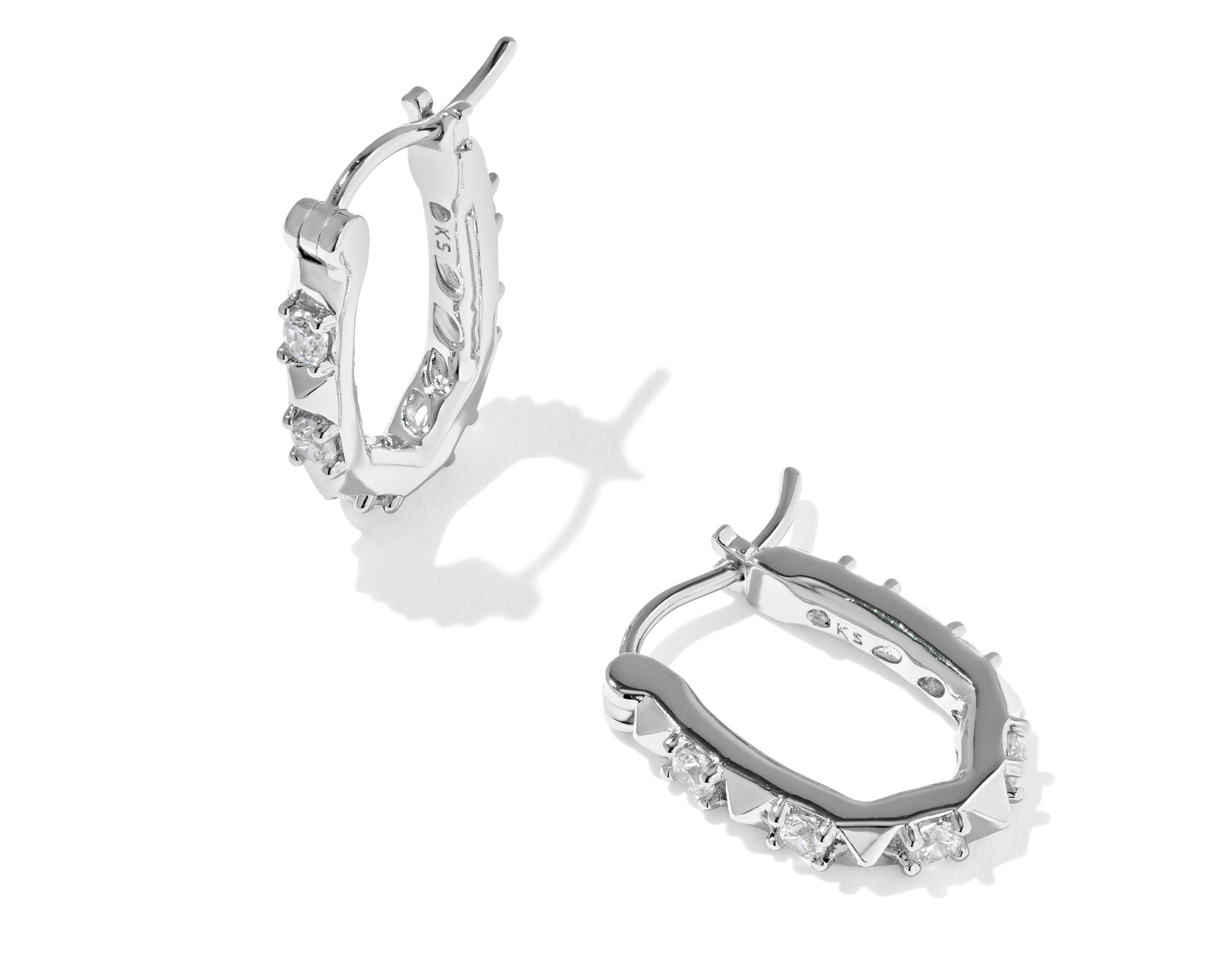Kendra Scott Fate Huggie Earrings in rhodium silver, a pair of hinged oval huggies with spike and cubic zirconia detail