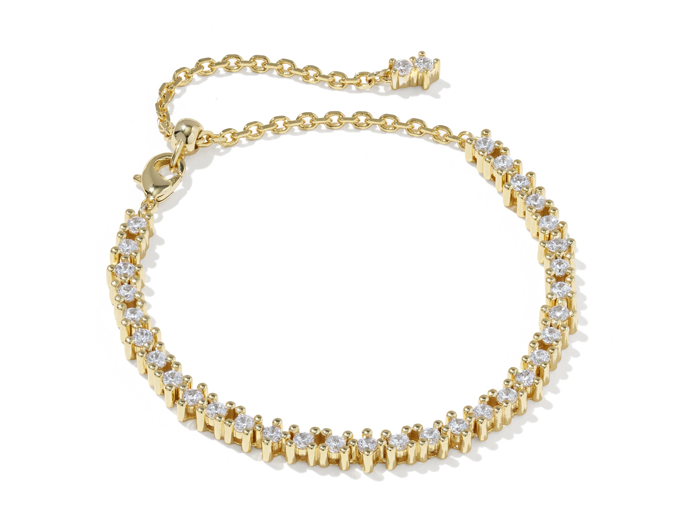 Kendra Scott Fate Tennis Bracelet in gold with a row of white cubic zirconia and extender chain