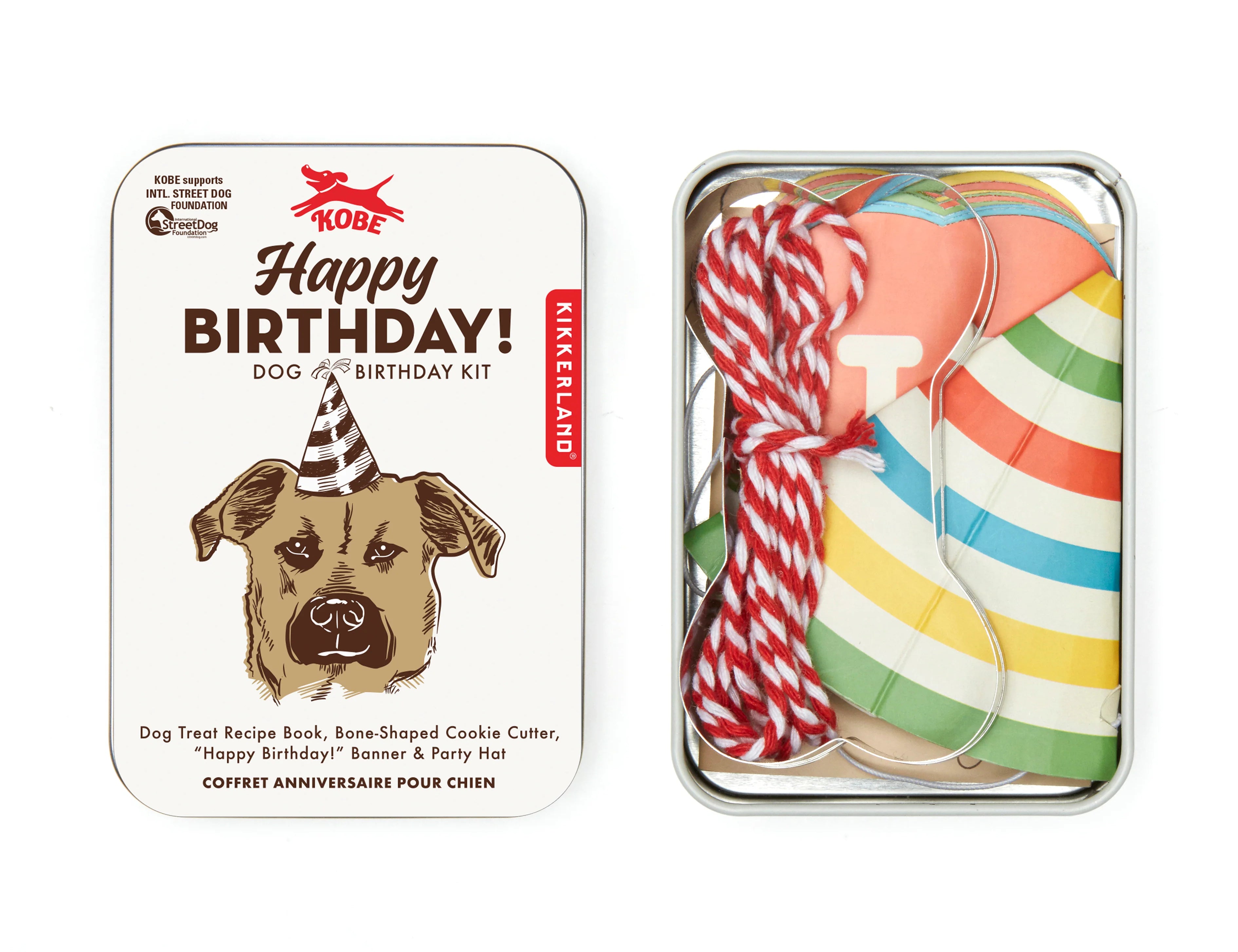 Kikkerland Dog Birthday Kit tin with a cookie cutter, banner, party hat and string inside