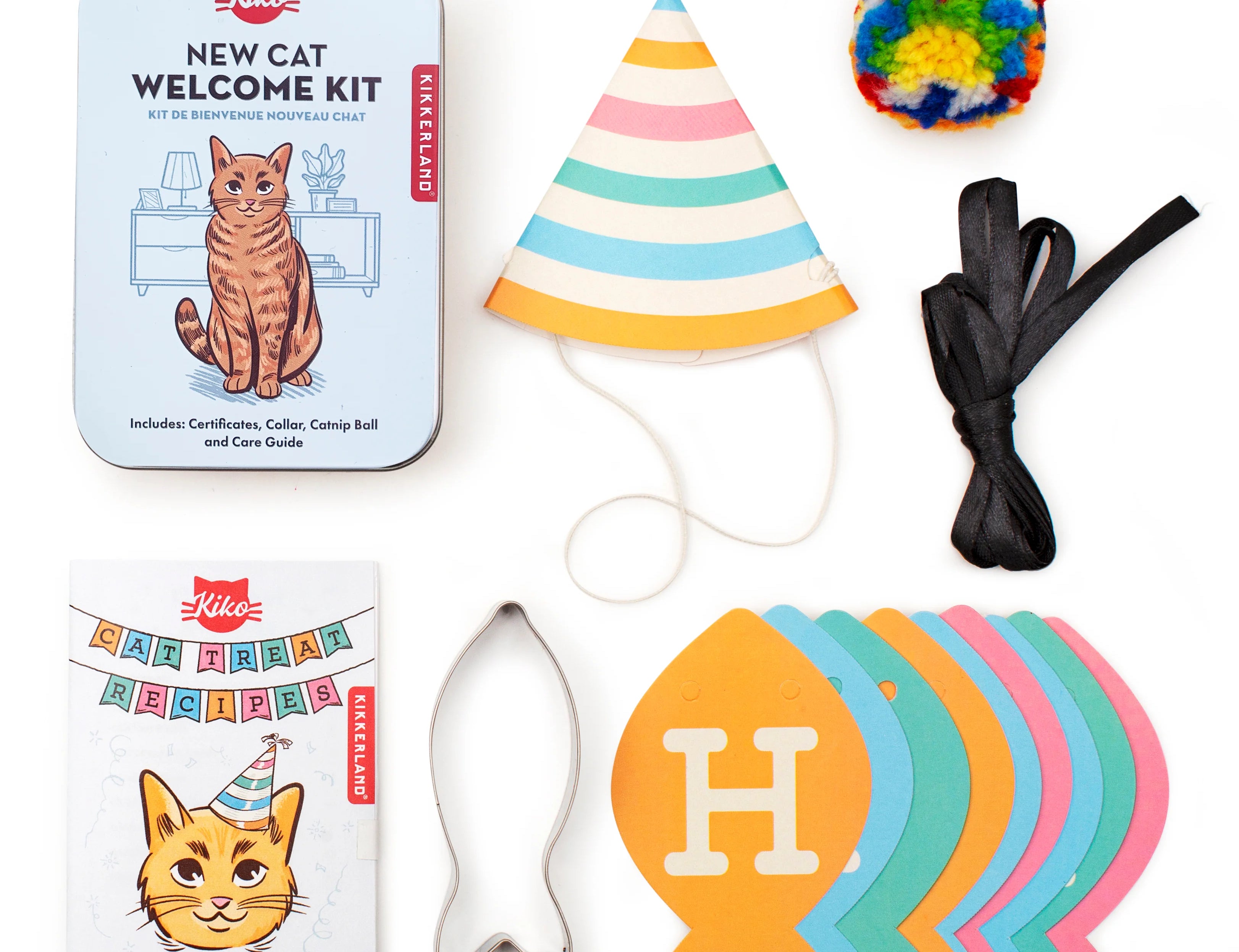 Kikkerland Kiko Cat Happy Birthday Set contents: tin, party hat, pom ball, fish cookie cutter and fish banner